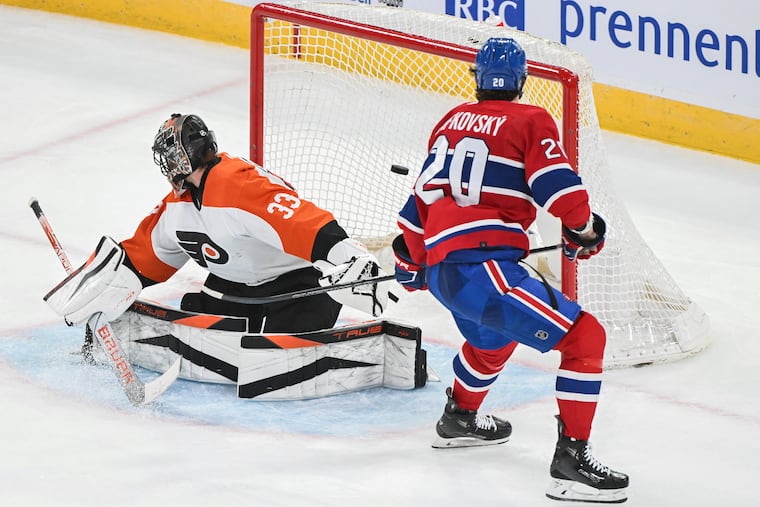 The Canadiens' Juraj Slafkovsky scores his third goal against Flyers goaltender Samuel Ersson.