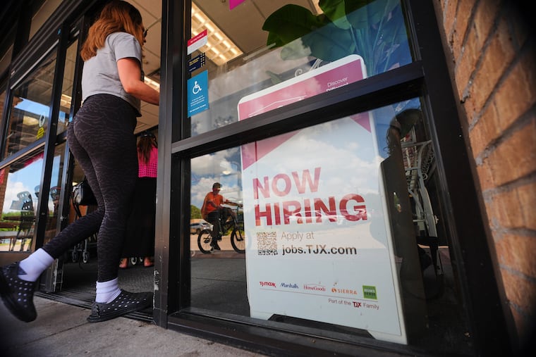 A sign announces hiring, July 15, 2025, in Richardson, Texas.