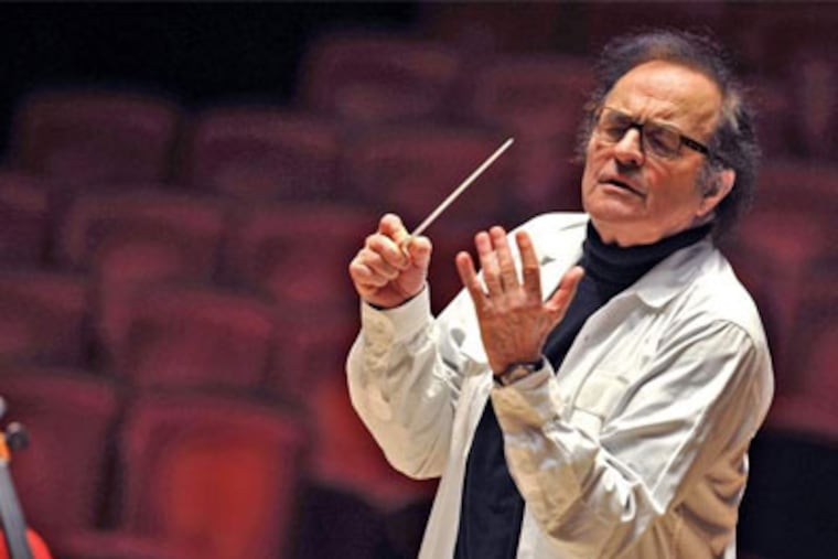 Conductor Charles Dutoit rehearses the Philadelphia Orchestra. He has filled various roles during his more than 30 years’ association with the orchestra — from podium guest to director of the orchestra’s two summer seasons to his latest four years as chief conductor. (CLEM MURRAY / Staff Photographer)
