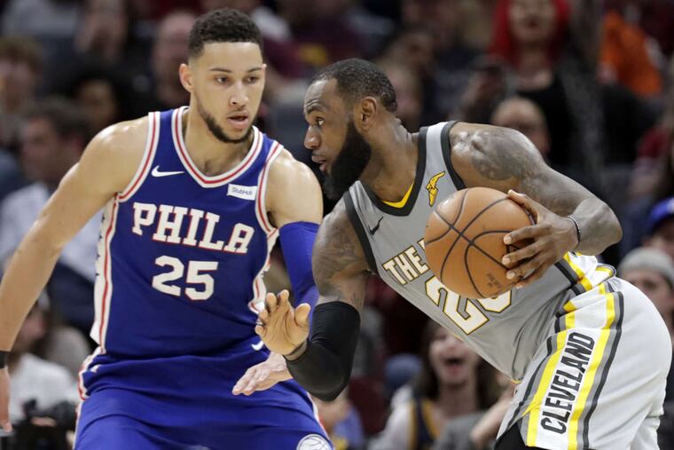 Cleveland Cavaliers' LeBron James (23) drives abasing Philadelphia 76ers' Ben Simmons (25), from Australia, in the second half of an NBA basketball game, Thursday, March 1, 2018, in Cleveland. (AP Photo/Tony Dejak)