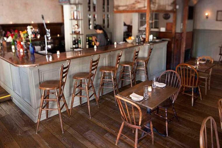 Bar seating and the dining area at Society Hill Society help to set the historical mood.