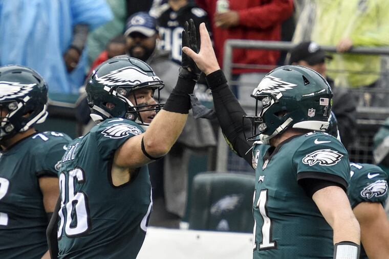 Philadelphia Eagles quarterback Carson Wentz (right) and tight end Zach Ertz slap high-five after connecting on a 1-yard touchdown pass against the San Francisco 49ers at Lincoln Financial Field October 29, 2017. The Eagles won 33-10. CLEM MURRAY / Staff Photographer