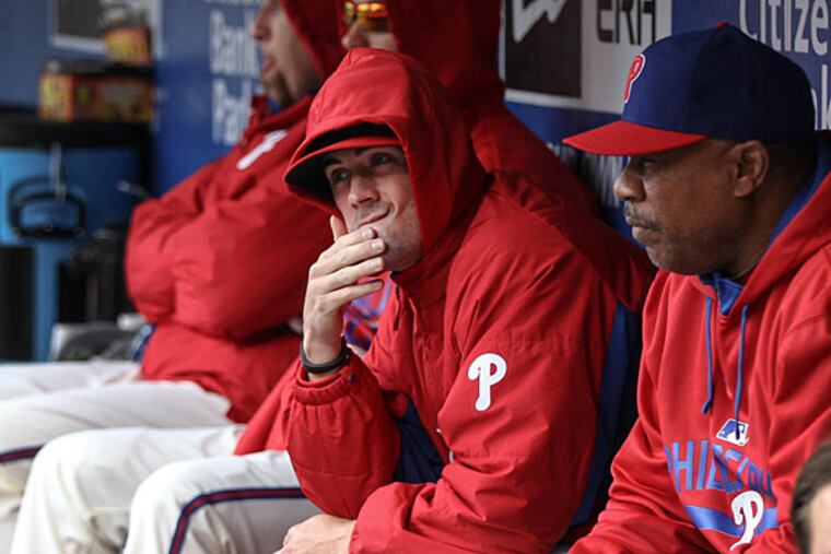 Phillies' pitcher Cole Hamels rubs his chin watching his team play the Marlins during the 9th inning at Citizens Bank Park in Philadelphia, Thursday, April 23, 2015. The Marlins beat the Phillies 9-1. (Steven M. Falk/Staff Photographer)