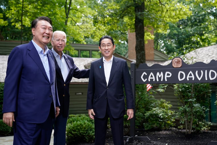 South Korea's President Yoon Suk Yeol, left, President Joe Biden and Japan's Prime Minister Fumio Kishida, right, meet at Camp David, the presidential retreat, near Thurmont, Md.