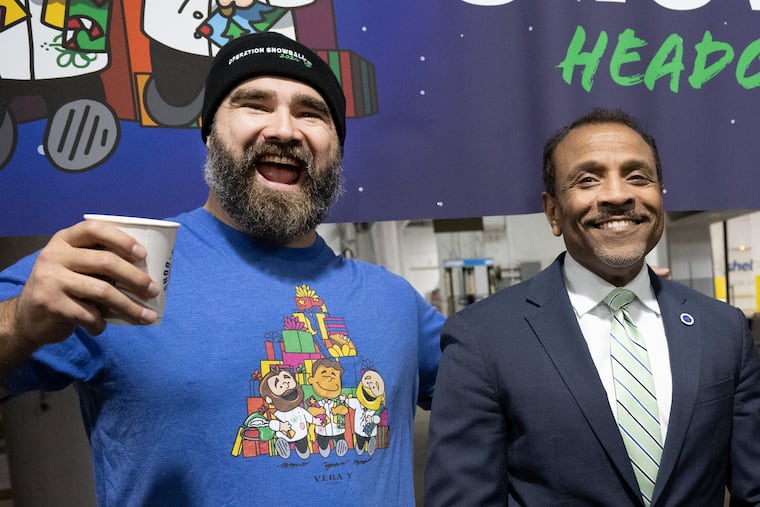 Philadelphia Eagles’ Jason Kelce shares a laugh with School District of Philadelphia Superintendent Tony B. Watlington Sr.