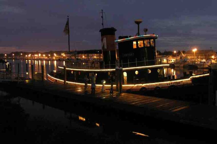 The 1902 tug Jupiter will lead Saturday's Seaport Parade of Lights on the Delaware at Penn's Landing. Sponsors hope the parade will become an annual event.