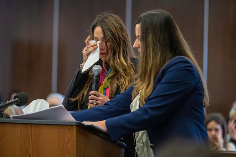 Jeanne Pepper, left, mother of Blaze Bernstein, wipes away tears as she gives a victim impact statement in court in Santa Ana, Calif., Friday, Nov. 15, 2024, prior to sentencing of Samuel Woodward, who was convicted of a hate crime murder for the killing of former classmate Blaze Bernstein. Senior Deputy District Attorney Jennifer Walker stands at right. (Mark Rightmire / Orange County Register via AP)
