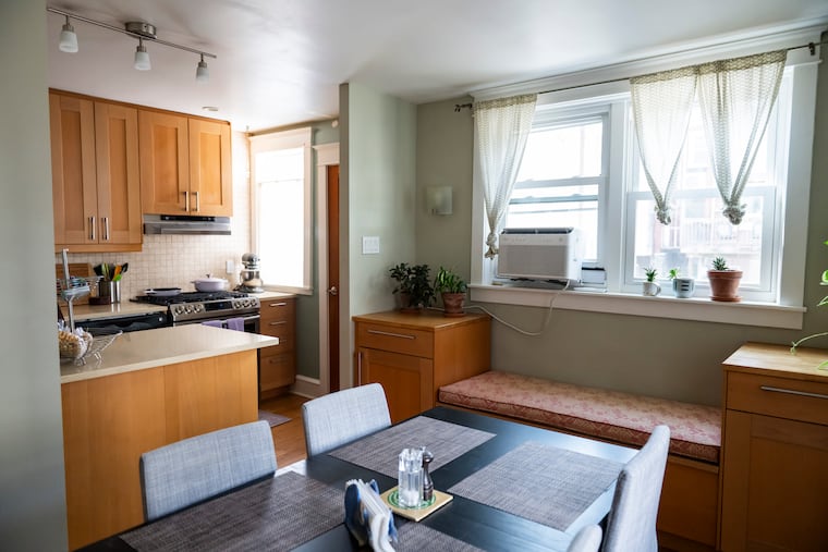 The dining room and kitchen space at Ross’ home in East Falls.