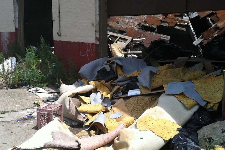 Complaints about illegally dumped trash, like this pile in North Philly, should be called in to 311, not the 911 emergency line.