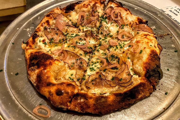 Potato pizza with marinated potatoes, bechamel, mozzarella, garlic oil, and chives at Sally.