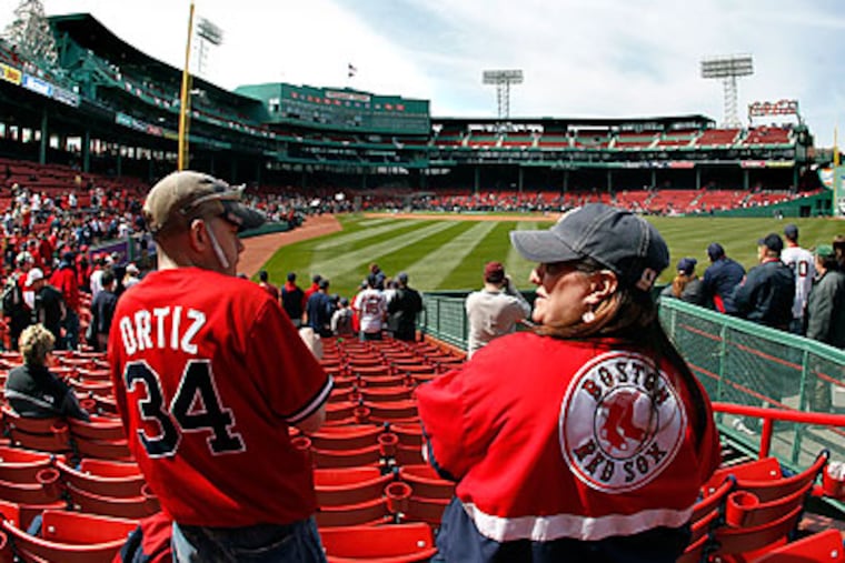 Boston fans have become spoiled by the championships won by all four of their major professional teams. (Elise Amendola/AP)