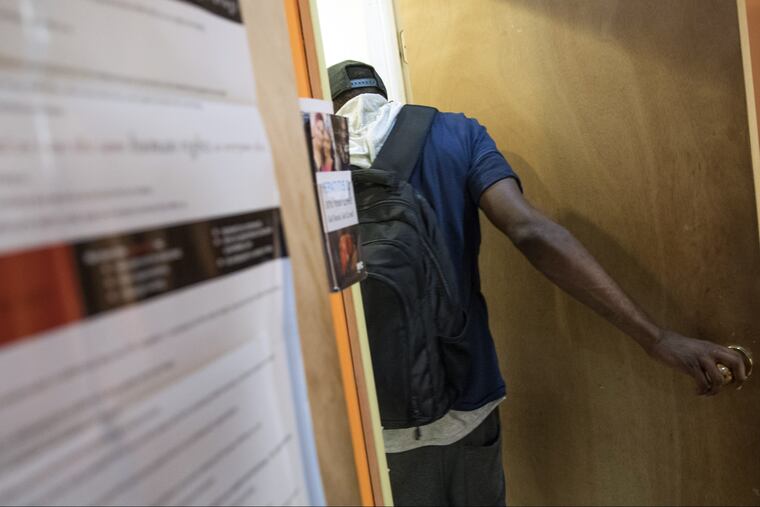In this Tuesday, July 3, 2018, photo, a member enters the bathroom at VOCAL-NY headquarters in the Brooklyn borough of New York. VOCAL-NY runs a needle exchange and harm reduction services, as well as overdose prevention and other services for people who use drugs. (AP Photo/Mary Altaffer)