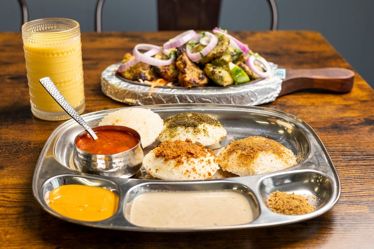 The idli karam podi platter at Madness of Masala in Trooper, Pa. A kebab platter from the tandoor oven is in the background.