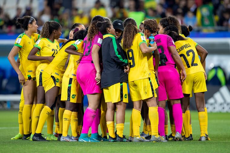 Players from Jamaica's women's soccer team in a huddle before their World Cup game against Australia last summer.