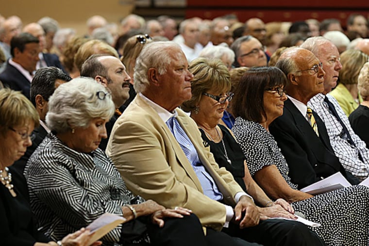 A crowd listens during a memorial mass for Jack Ramsay at Hagan Arena. (David Maialetti/Staff Photographer)