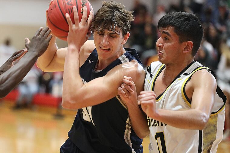 St. Augustine's Matt Delaney (left) fends of Bordentown's Armaan Gill in the fourth quarter.