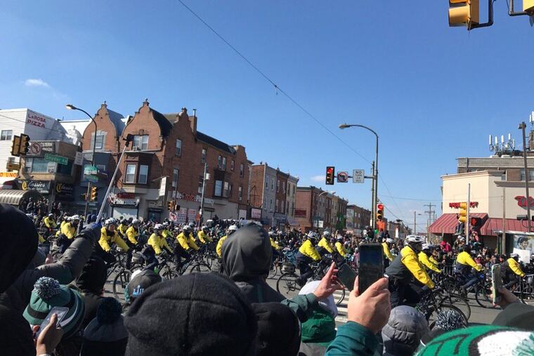 The excitement isn’t reserved for fans — police officers are having fun, too. Here, police officers ride by Snyder and Broad.