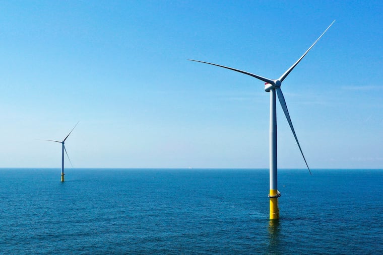 Two of the offshore wind turbines that have been constructed off the coast of Virginia Beach, Va., are viewed June 29, 2020. South Jersey is set to become the site of hundreds of offshore wind turbines, generating clean energy to help power the state. That's a good thing, argues Ed Potosnak.