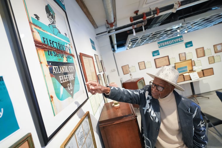 Ralph Hunter, president of the African American Heritage Museum of Southern New Jersey, in Atlantic City, looks over the new exhibit "Stereotypes — How African Americans Have Been Depicted In Advertising.” This section displays advertisements from Atlantic City Electric with "Elec" the racist black minstrel-ish mascot used from the 1927 to 1952.