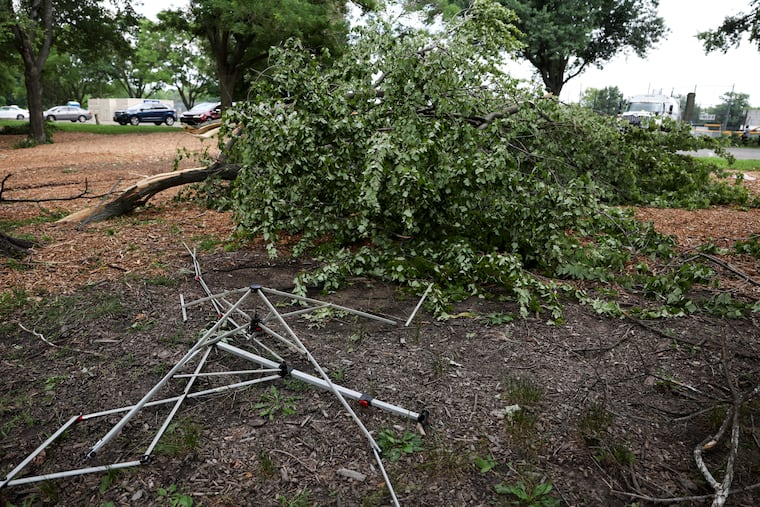 A broken tent lies on the ground at FDR Park in South Philly on Sunday, July 12, 2026. On Saturday, severe storms caused damage across the region. Vendors at the Southeast Asian Market at FDR Park sustained damage to their tents and equipment, and lost food and other merchandise in the storms.
