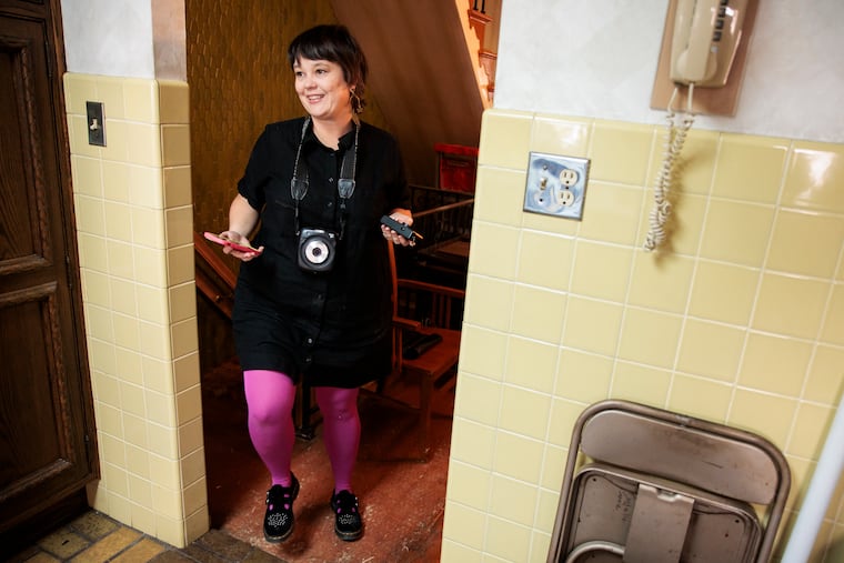 Real estate agent Sue Liedke photographs 1725 E. Johnston St., listed with Exit Elevate Realty. Liedke's popular Instagram account shares photos of quirky South Philly homes and the interest spurred her to get her real estate license.