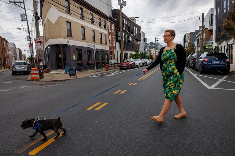 Amber Wilkie and her 8-year-old Yorkie-Schnauzer mix, Duncan, often run errands together during walks in the Kensington and Fishtown neighborhoods.