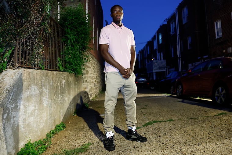 Abdoulaye Cherif stands near his West Oak Lane home on July 23, not far from where his father, Mamadou Fadel Cherif, was arrested by ICE. He has been detained for about two weeks so far.