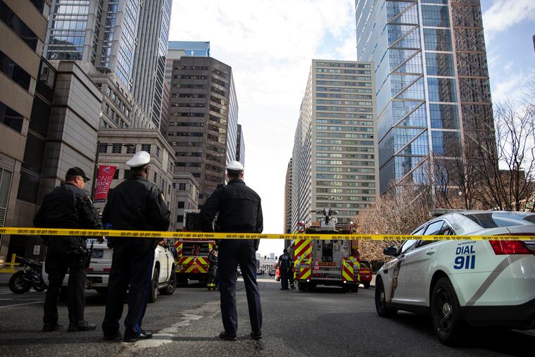 Philadelphia Police and Fire Departments block off John F. Kennedy Boulevard and 18th Street due to a barricade situation on Tuesday.