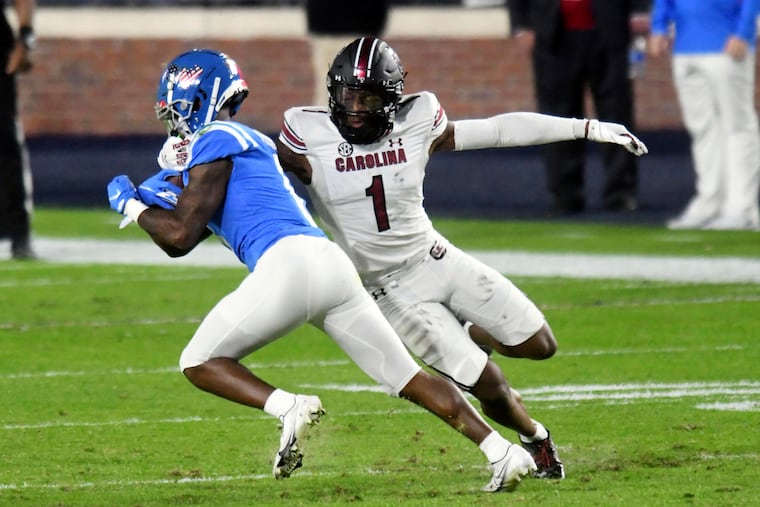 Mississippi wide receiver Elijah Moore is tackled by South Carolina defensive back Jaycee Horn.