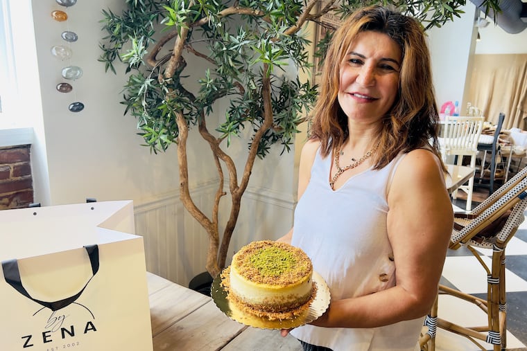 Pastry chef Zena Demirceviren with a cheesecake at her shop By Zena at 41 E. Main St. in Moorestown on Aug. 29, 2025.