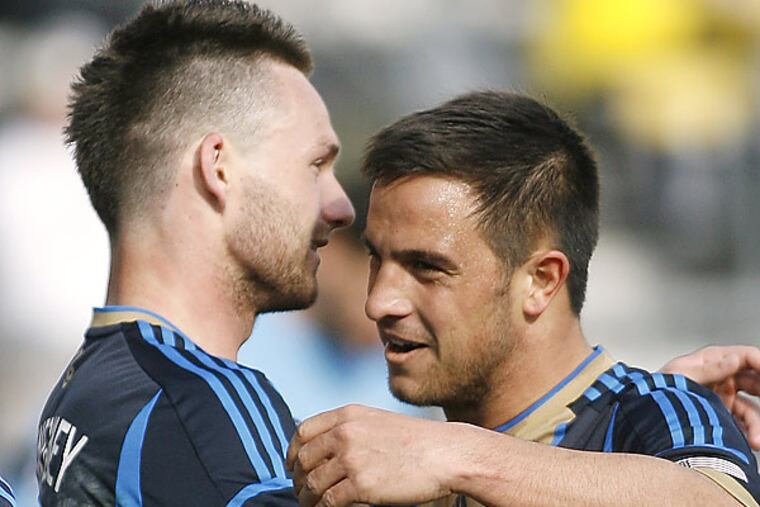 Philadelphia Union midfielder Danny Cruz, right, celebrates with Jack McInerney (Mike Munden/AP)