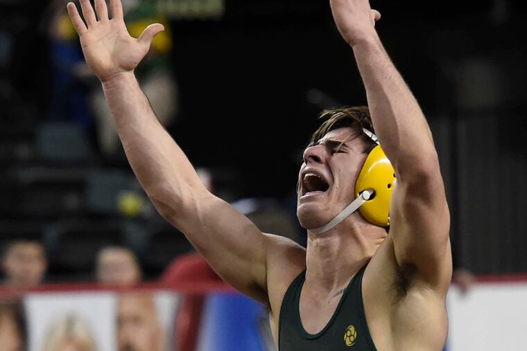 Clearview's Zach Firestone celebrates his 132-pound state championship with a 3-1 decision.