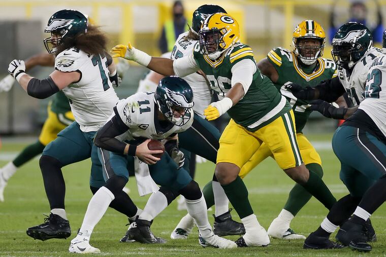 Packers DL Kingsley Keke moves in to sack Eagles QB Carson Wentz (11) in the second quarter of Sunday's 30-16 loss.