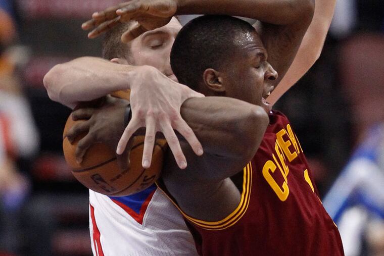 The Sixers' Spencer Hawes prevents the Cavaliers' Dion Waiters from scoring, no foul called at the Wells Fargo Center on Sunday. (Ron Cortes / Staff Photographer)