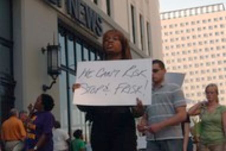 Protesters rally outside the Daily News over Signe editorial cartoon.