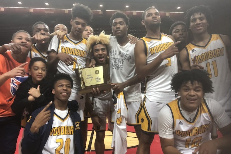 Woodbury players celebrate their Group 1 state final win over Cresskill, 60-58