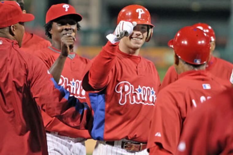 The Phillies' Jason Donald celebrates with teammates after hitting a walk off base hit with bases loaded in the bottom of the ninth against the Tampa Bay Rays to win the preseason game, 3-2, Friday. (Steven M. Falk / Staff Photographer)