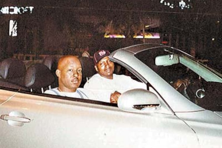 The world of Maurice Phillips (in the passenger seat) was one of fancy cars, parties and lovers. He got five life terms last week for murder and drug dealing.
