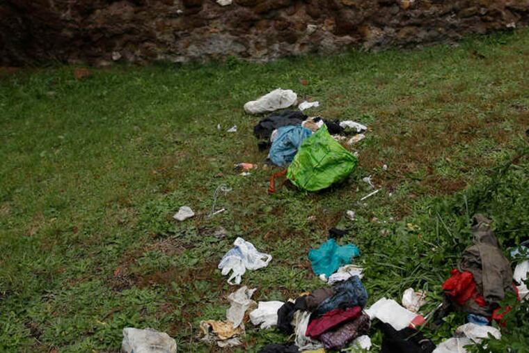Trash is strewn about on a lawn of the Campidoglio, on Capitoline Hill, overlooking the Marcello Theater in downtown Rome.