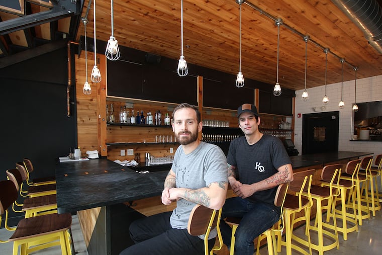Owners Mike Pasquarello (left) and Bryan Mayer at the first-floor bar at Kensington Quarters, 1310 Frankford Ave. (MICHAEL KLEIN / Philly.com)