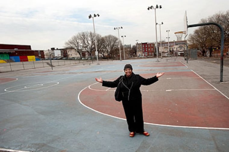Judith Robinson, a North Philadelphia community activist, stands on the parcel the school district has given to the city for $1. (Sharon Gekoski-Kimmel / Staff Photographer)