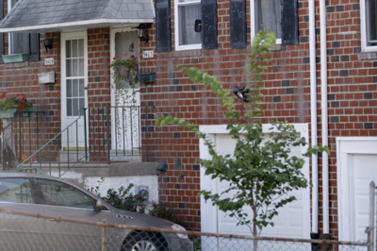 In this Wednesday, Sept. 19, 2012 photo, the home of Johann "Hans" Breyer, center, is seen in Philadelphia. (AP Photo/Matt Rourke)