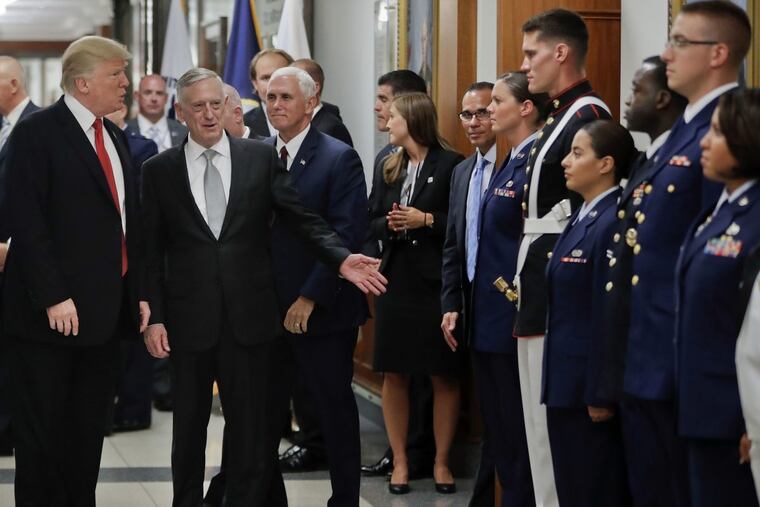 Greeting military in July at the Pentagon: (from left) President Trump, Defense Secretary Jim Mattis, and Vice President Pence.