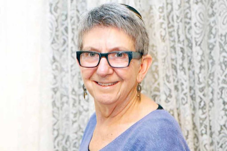 Rabbi Linda Holtzman of the Jewish community group, Tikkun Olam Chavurah, in her West Mount Airy home on Tuesday, September 23, 2014. The Jewish group and a South Philly church are part of the New Sanctuary Movement of Philadelphia that will be offering sanctuary to an undocumented immigrant (and his/her family) who is defying a federal deportation order and refusing to leave the country. (Yong Kim / Staff Photographer)