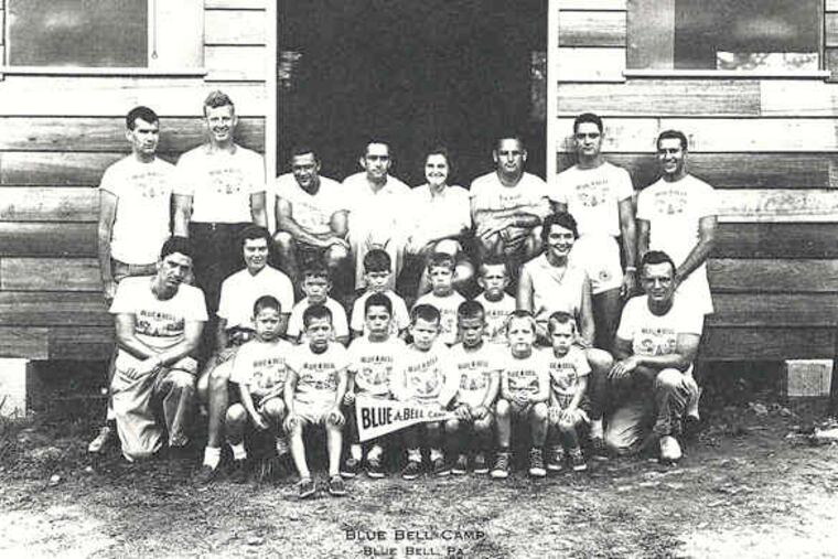 The Harrises, who stressed instruction in activities, sit in the middle of the back row in a 1955 Blue Bell Camp photograph.