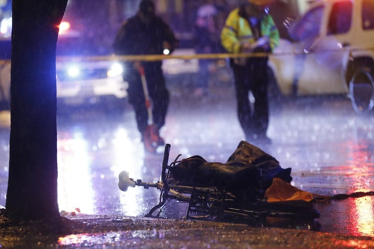 Philadelphia Police investiigate the scene at 10th and Spring Garden St in Phila., Pa. where a SUV vs bicylist accident occured during the evening hours of May 12, 2018.