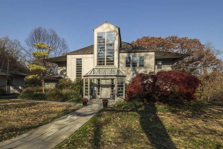 In addition to converting a pool to a koi pond, the couple added gardens and flowering trees throughout the 2.15-acre lot.