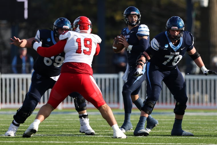 Villanova quarterback Connor Watkins, center, will lead the Wildcats against Long Island University in its final nonconference game of the regular season on Saturday.