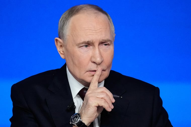Russian President Vladimir Putin gestures while speaking during his annual news conference and call-in show Friday in Moscow.