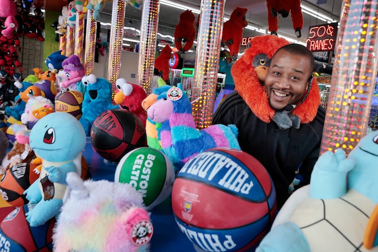 Nick Beamon works the squirt gun at Bobby Dee's Casino arcade in Wildwood on May 14, 2021.